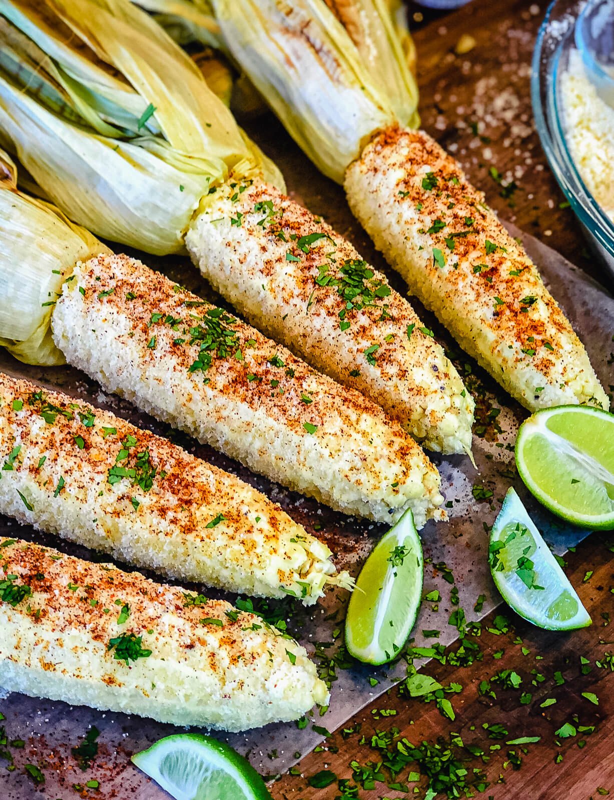 https://www.grillseeker.com/wp-content/uploads/2018/05/grilled-mexican-street-corn-seasoned-on-cutting-board.jpg