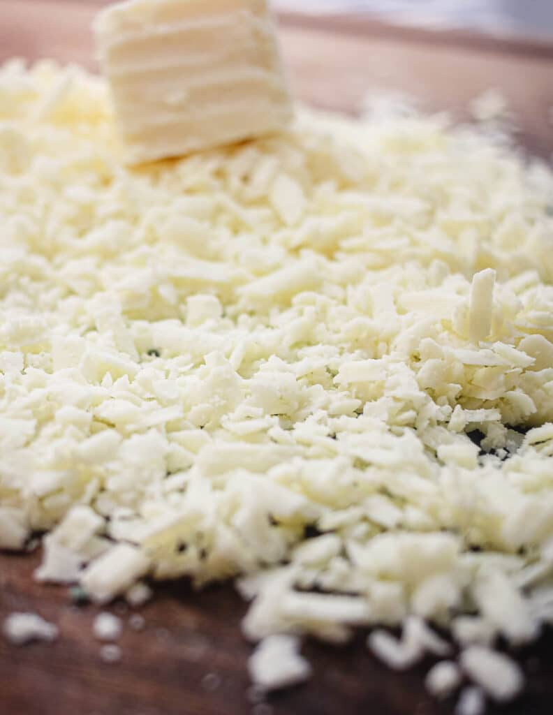 cojita cheese grated on a cutting board