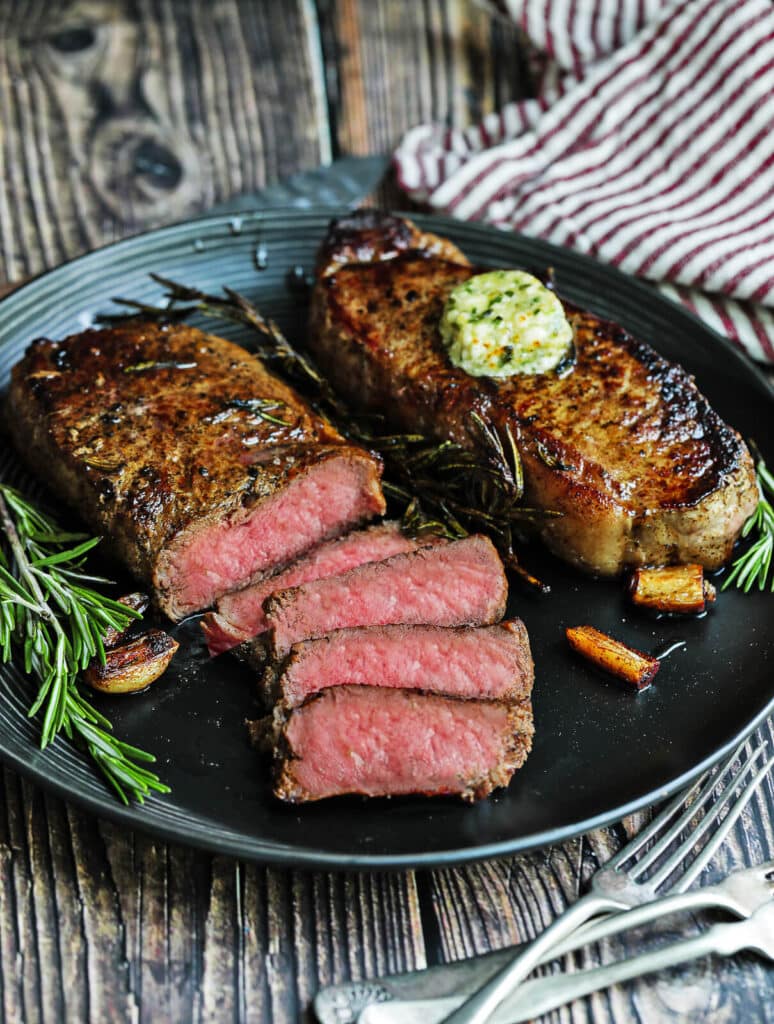https://www.grillseeker.com/wp-content/uploads/2019/09/pan-sear-steak-sliced-on-a-plate-774x1024.jpg