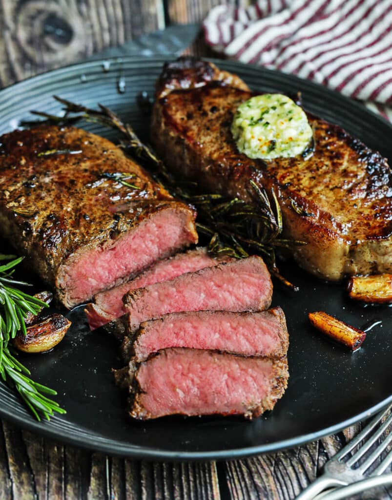 https://www.grillseeker.com/wp-content/uploads/2019/09/pan-sear-steak-sliced-on-a-plate-close-up-803x1024.jpg