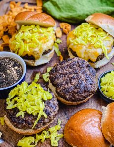 Mississippi pot roast burgers on a cutting board