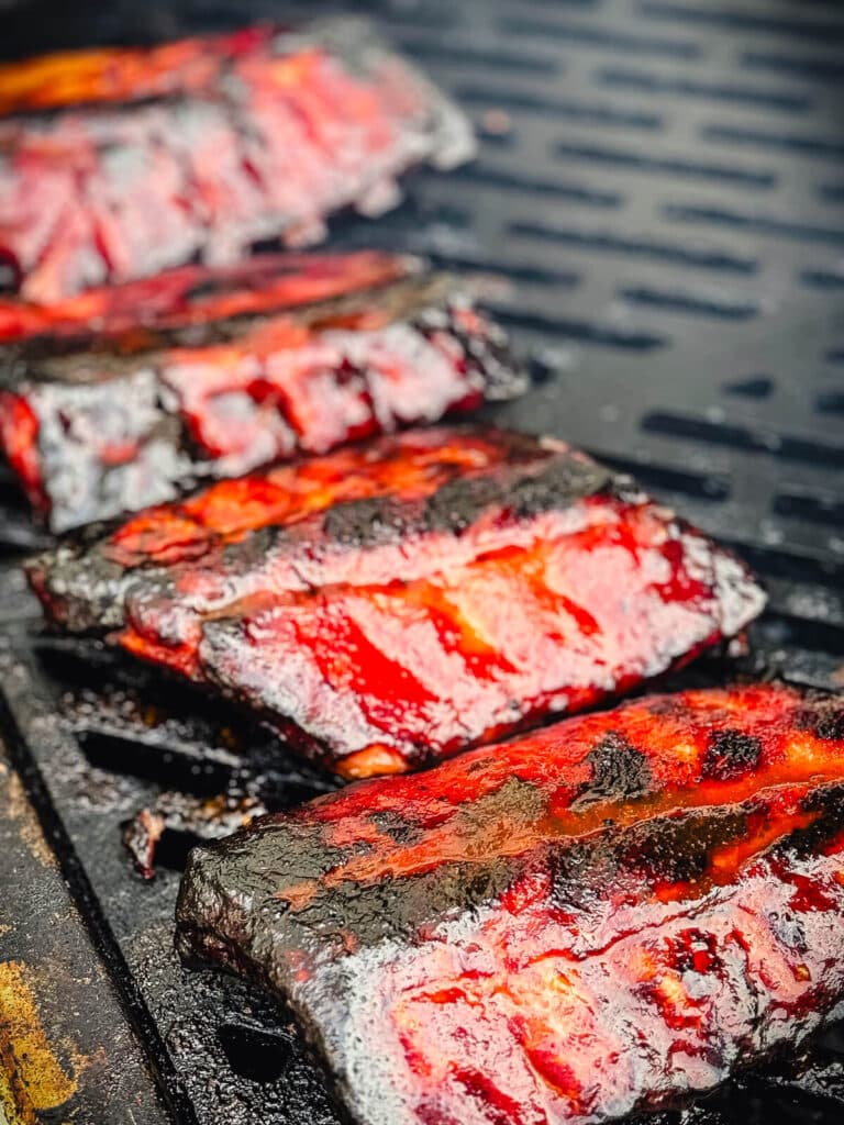 baby back ribs on a grill grate