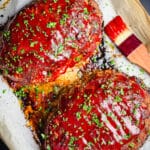 turkey meatloaf on a parchment lined baking sheet