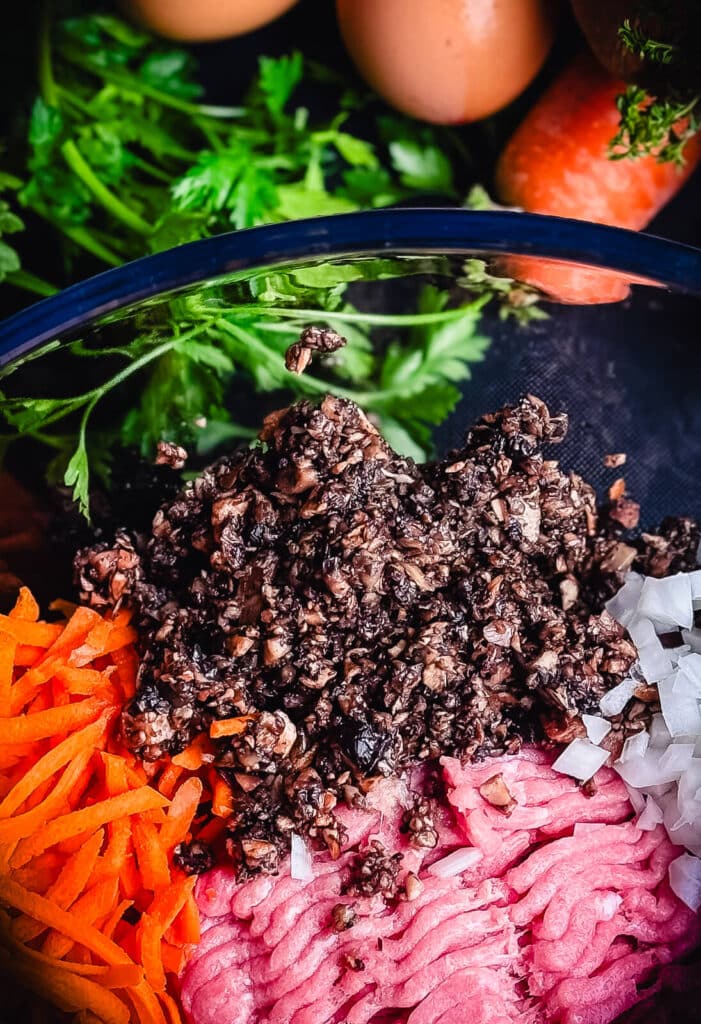 diced mushrooms in a bowl of ingredients