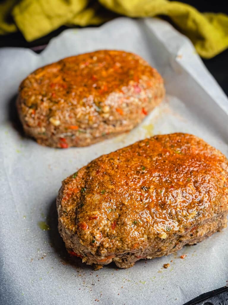 seasoned meatloaf ready to go in the oven