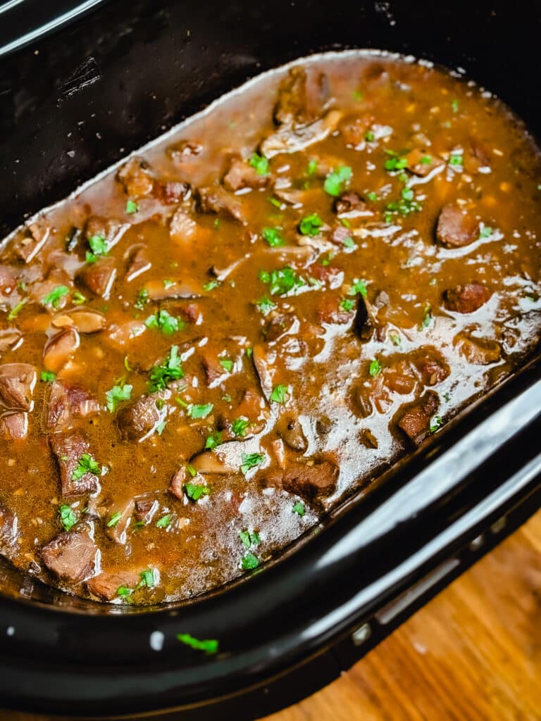 crockpot beef tips topped with parsley