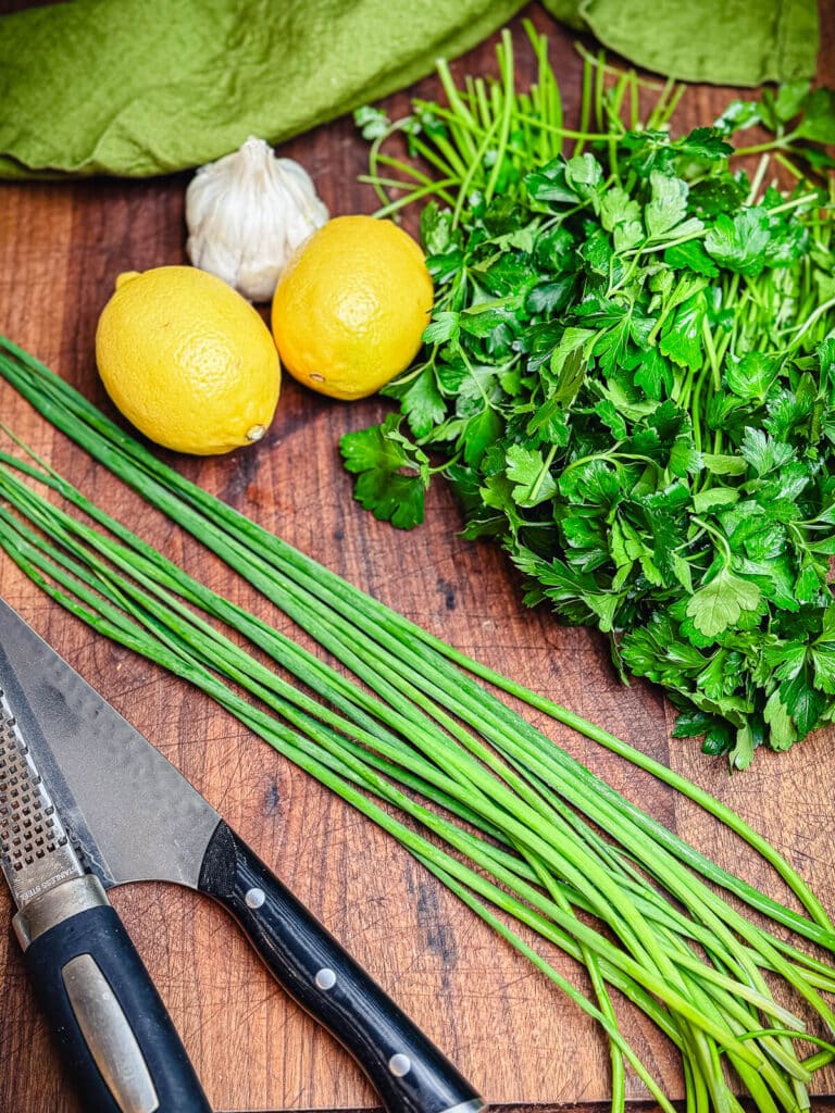 fresh herbs on a cutting board