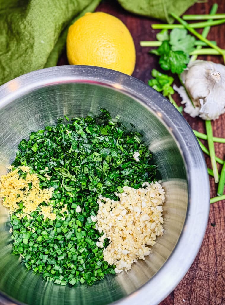 herbs and lemon zest in a mixing bowl