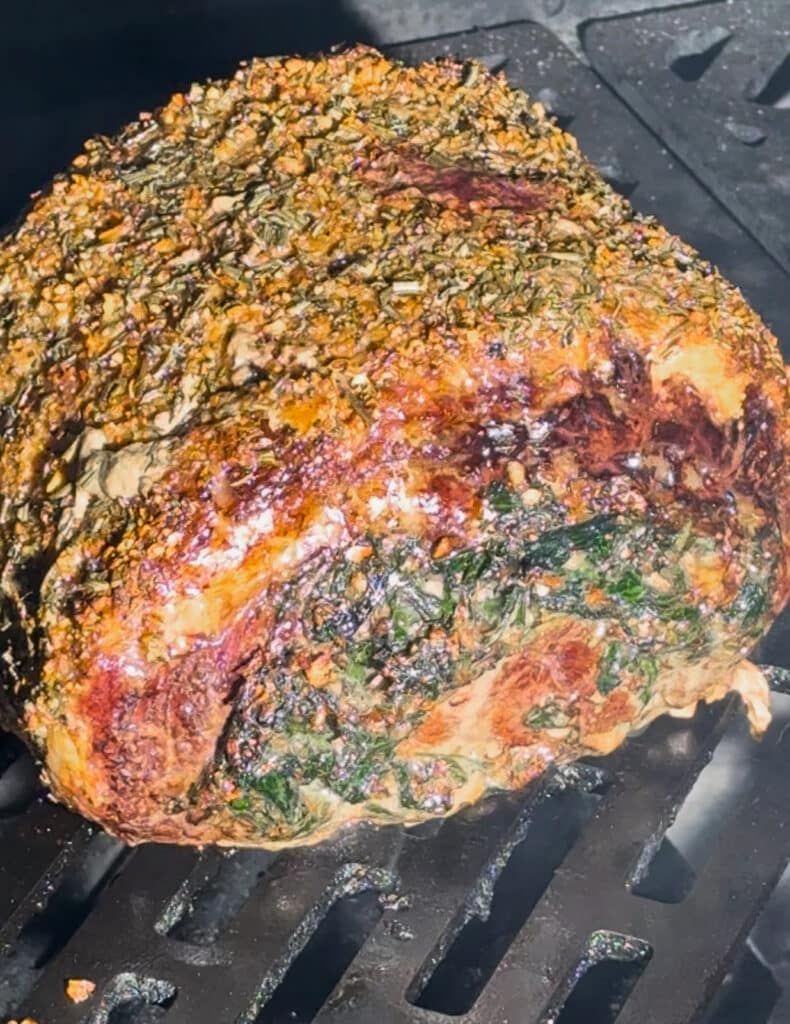 stuffed prime rib on a grill, cooked to medium rare