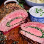 stuffed prime rib sliced on a cutting board