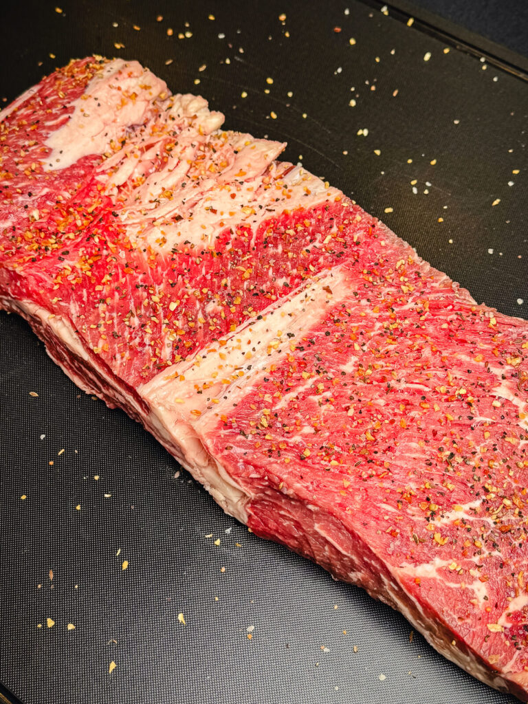 unrolled prime rib, seasoned with salt and pepper