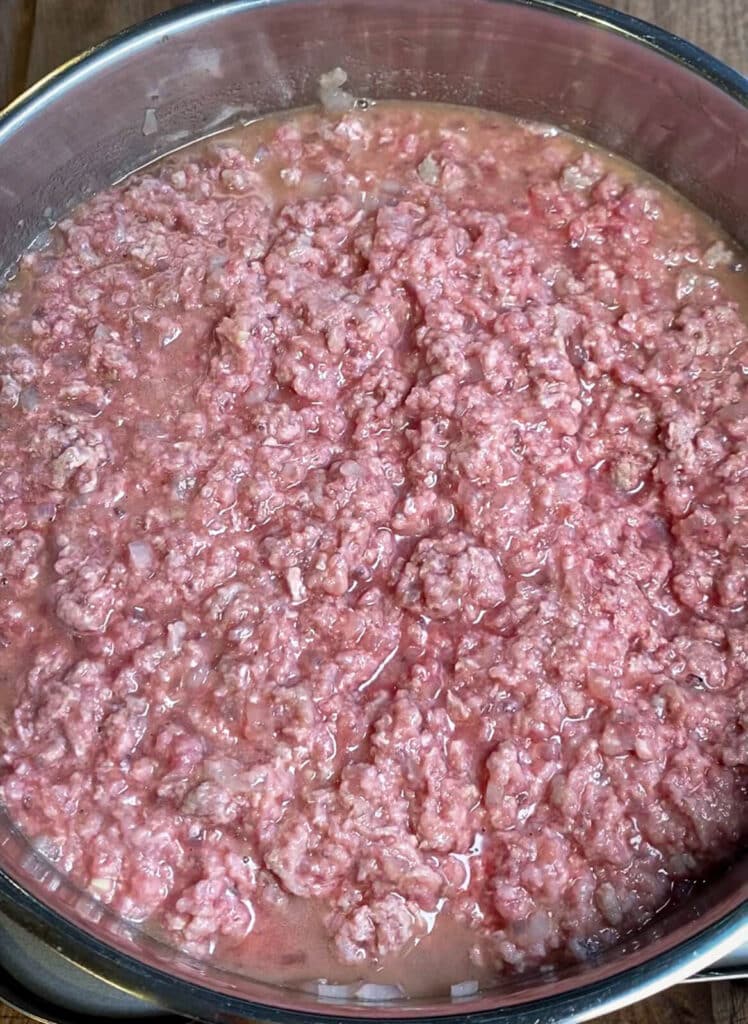 large pan of ground beef for coney island chili sauce