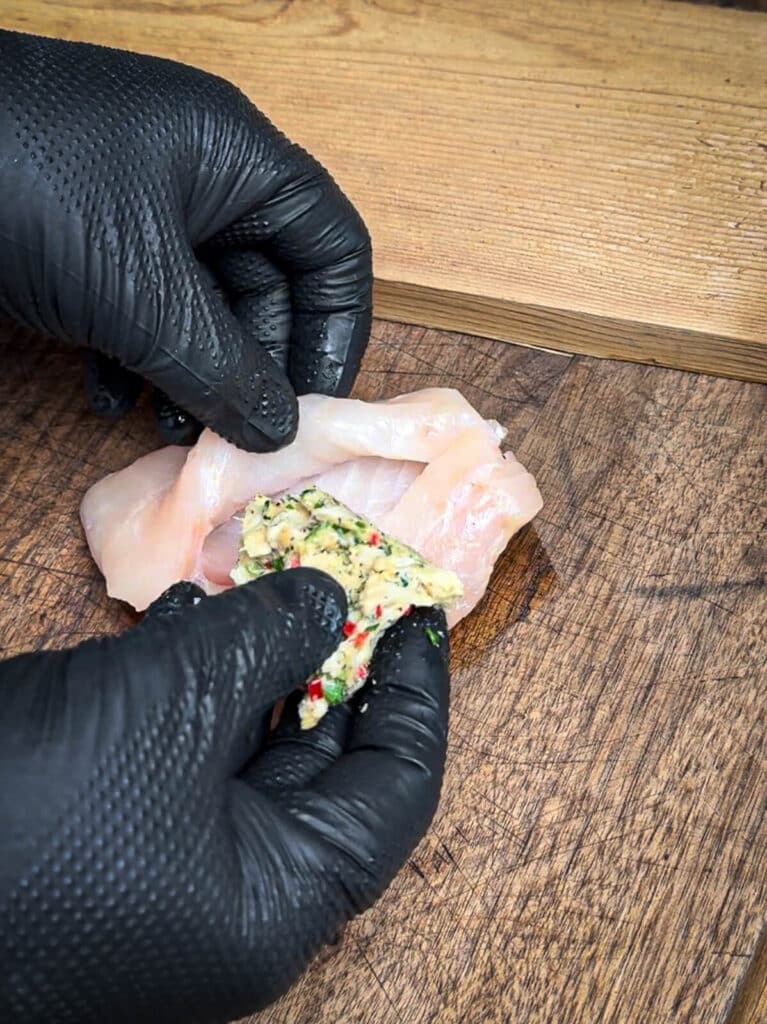 stuffing crab stuffing into a fish filet