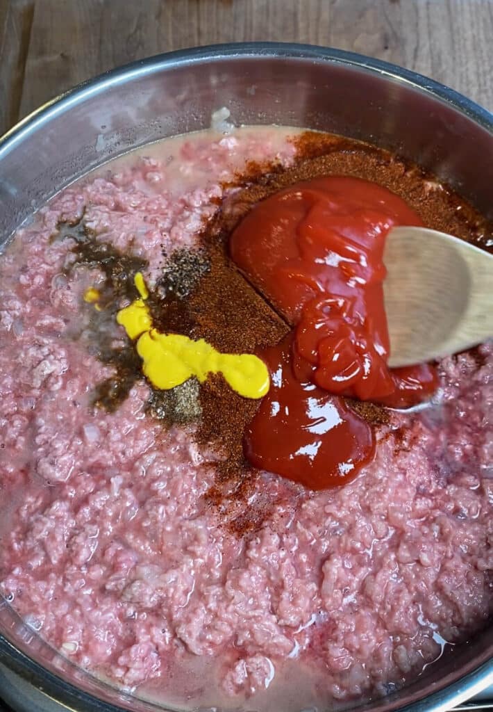 ingredients for Coney Island chili sauce in a large pan